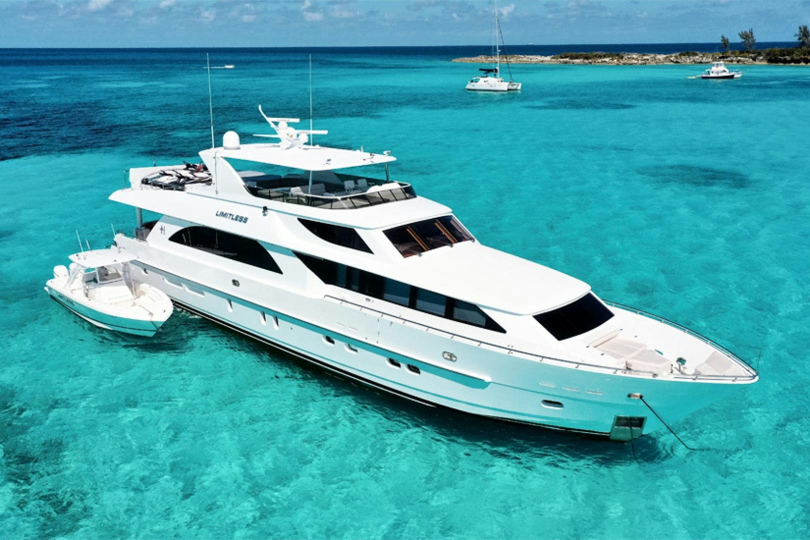 a white yacht in the water aboard LIMITLESS Yacht for Sale