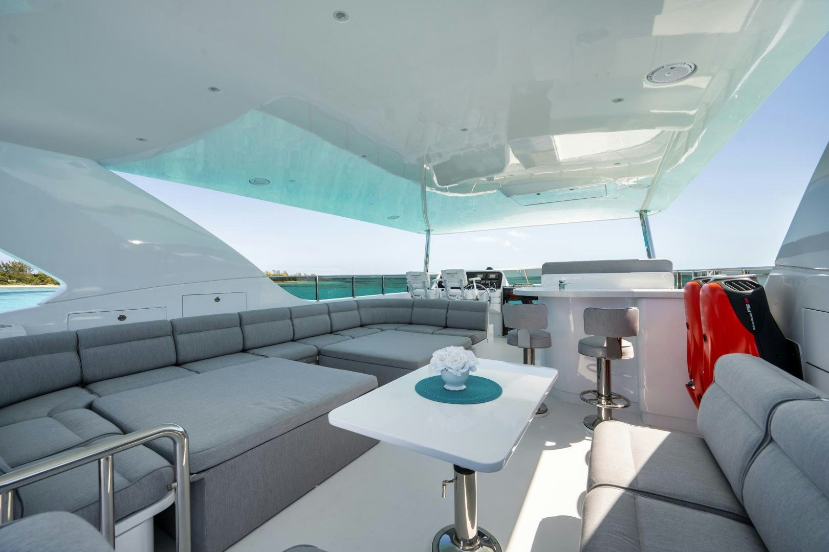 a room with a table and chairs aboard LIMITLESS Yacht for Sale