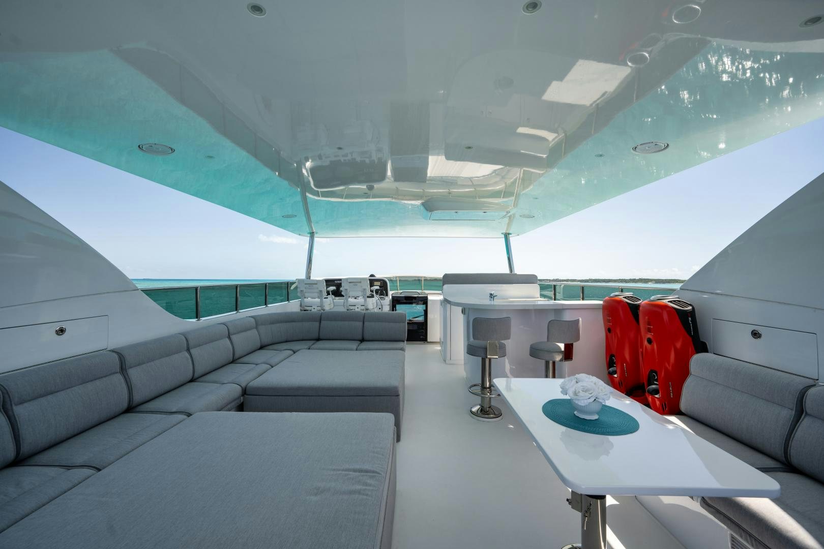 a room with a table and luggage aboard LIMITLESS Yacht for Sale