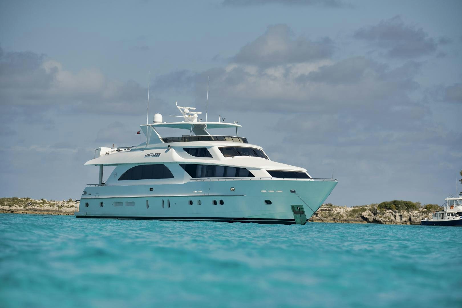 a white yacht in the water aboard LIMITLESS Yacht for Sale