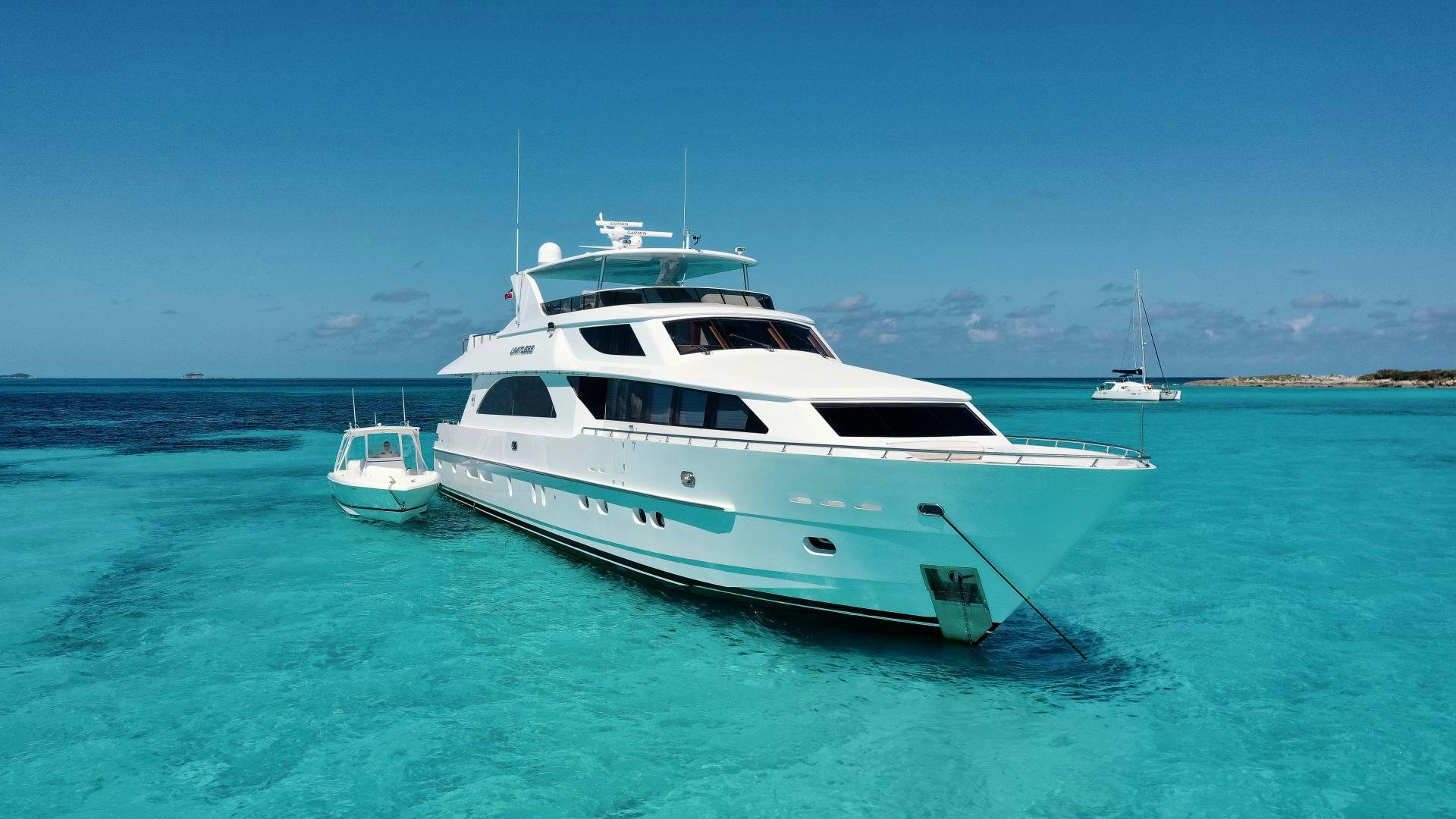 a white yacht in the water aboard LIMITLESS Yacht for Sale