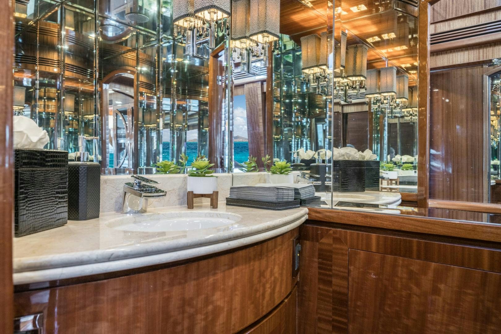 a kitchen with glass walls aboard LIMITLESS Yacht for Sale