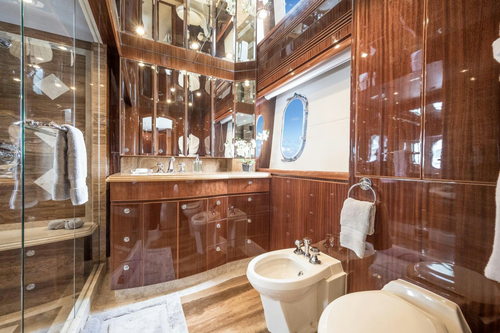 a bathroom with a sink and a mirror aboard LIMITLESS Yacht for Sale
