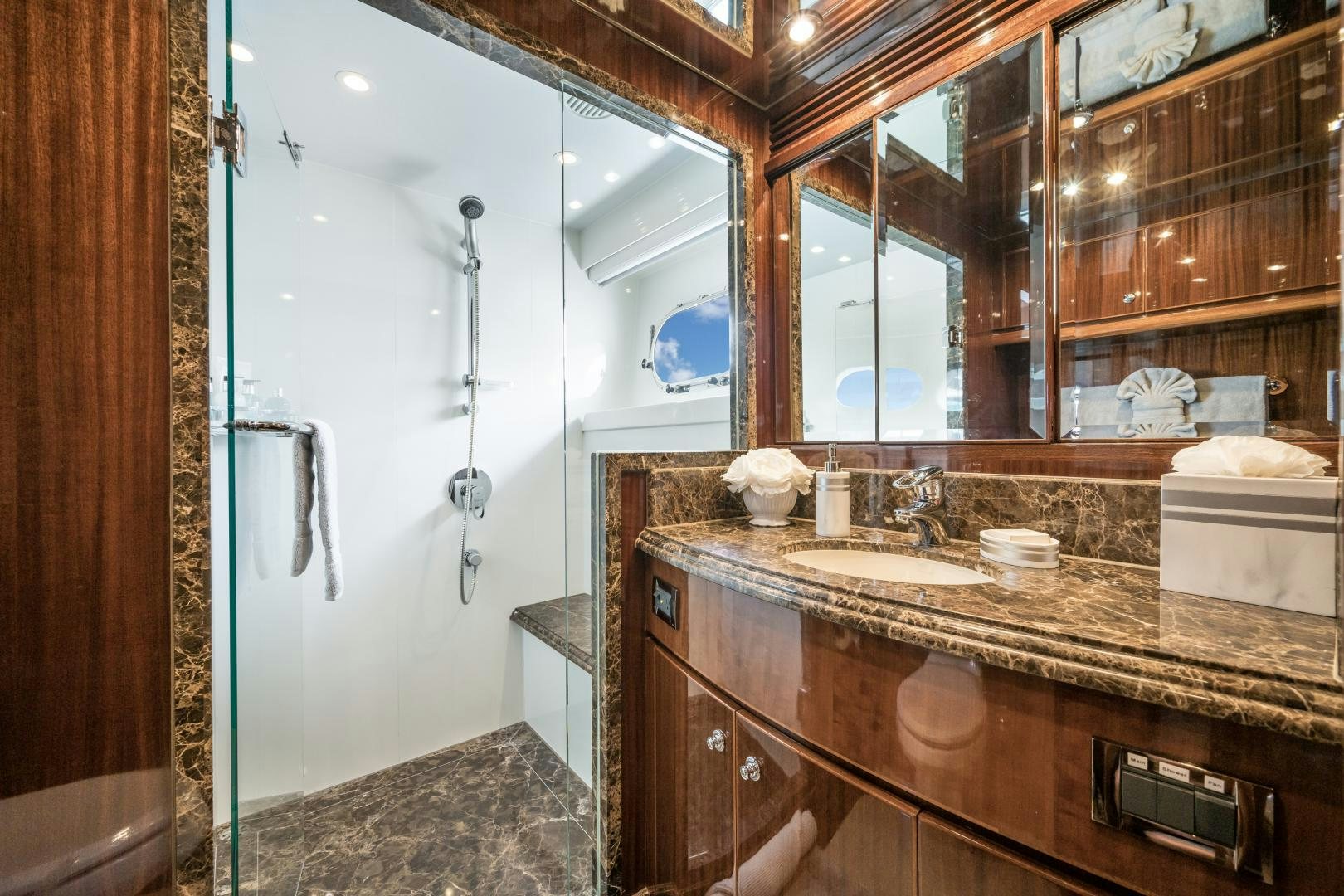 a bathroom with a large mirror aboard LIMITLESS Yacht for Sale