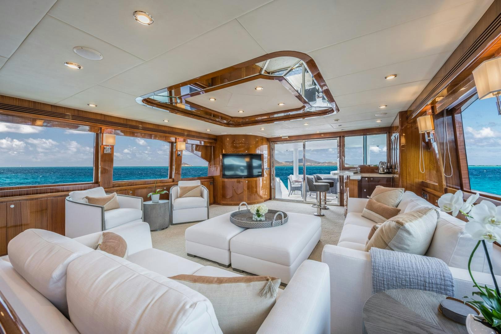 a living room with a large window aboard LIMITLESS Yacht for Sale