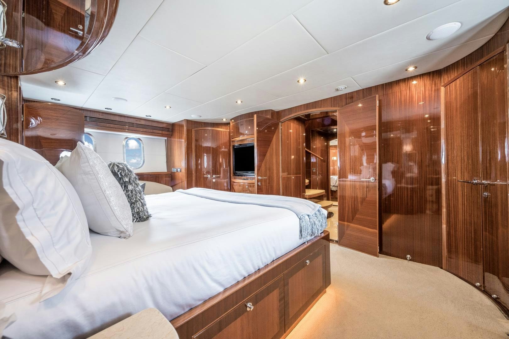 a bed in a cabin aboard LIMITLESS Yacht for Sale