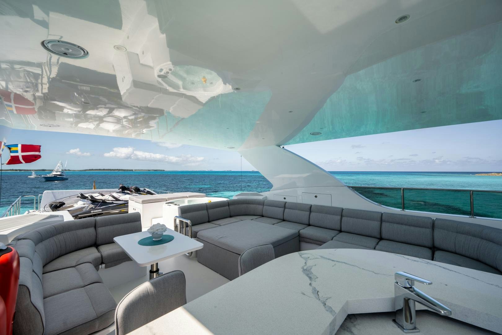 a room with a couch and a pool aboard LIMITLESS Yacht for Sale
