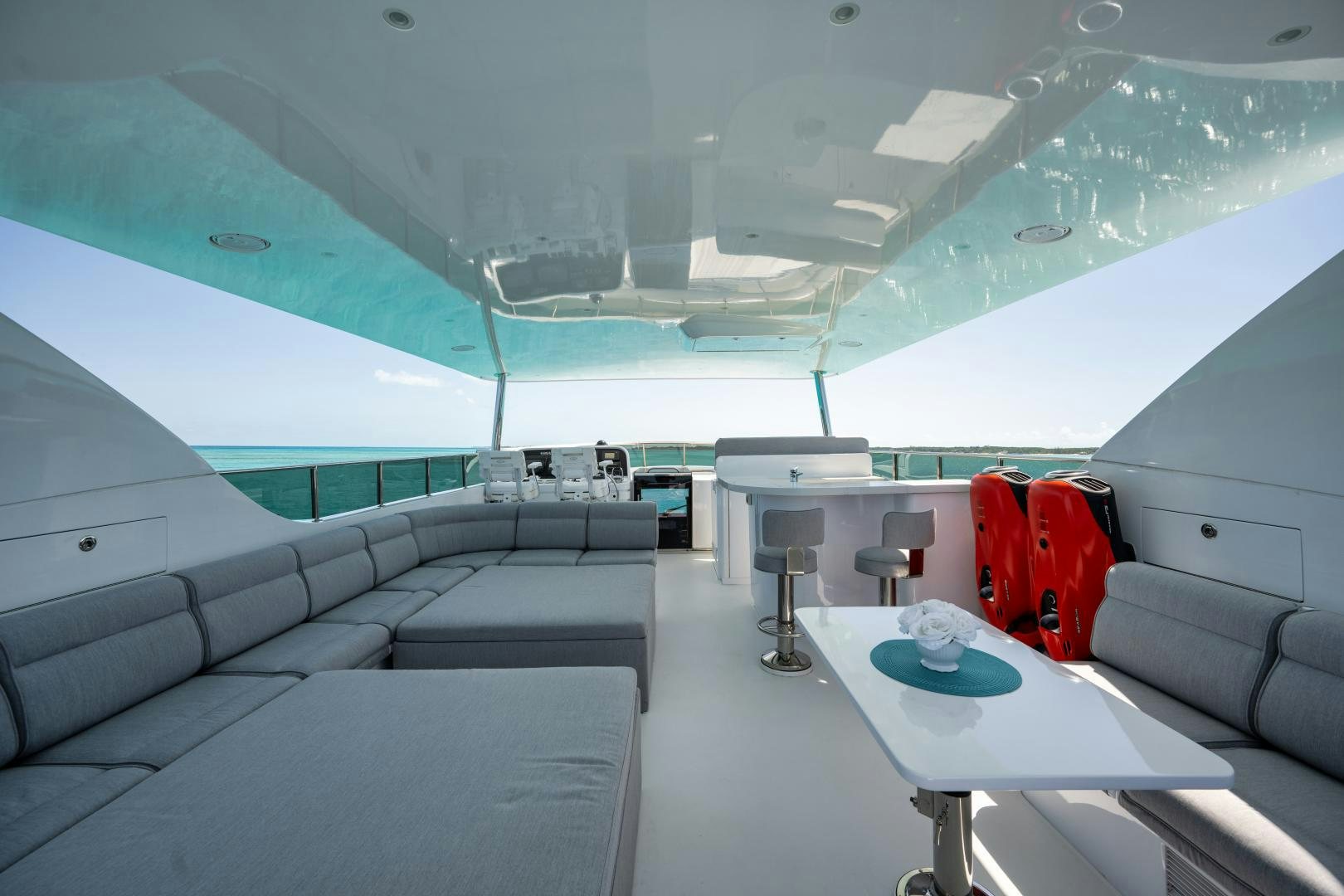 a room with a table and luggage aboard LIMITLESS Yacht for Sale