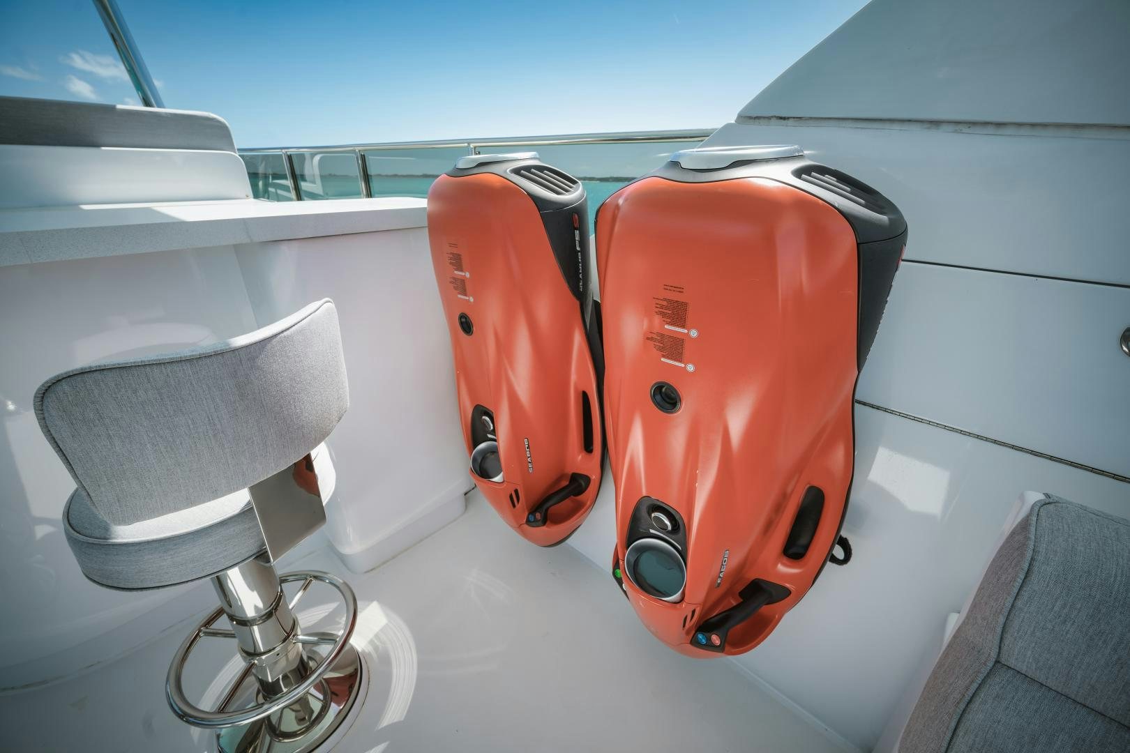 two orange and black skateboards on a white surface aboard LIMITLESS Yacht for Sale