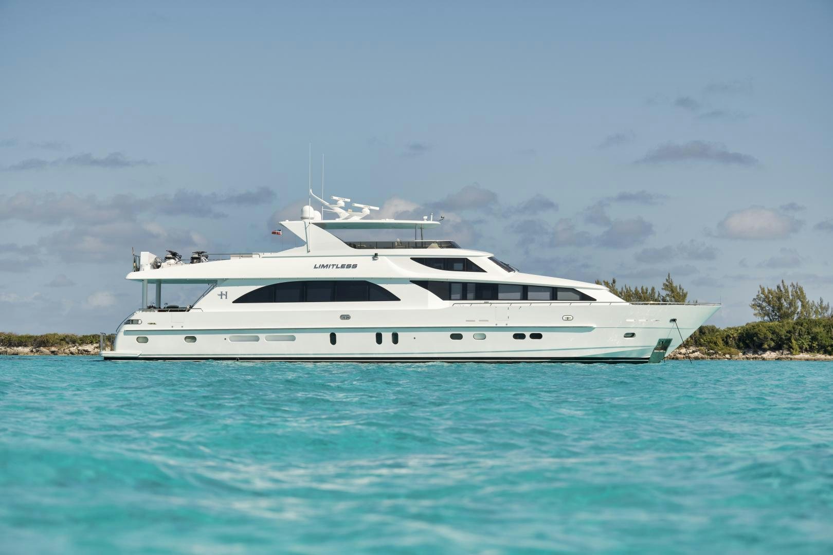a white yacht in the water aboard LIMITLESS Yacht for Sale