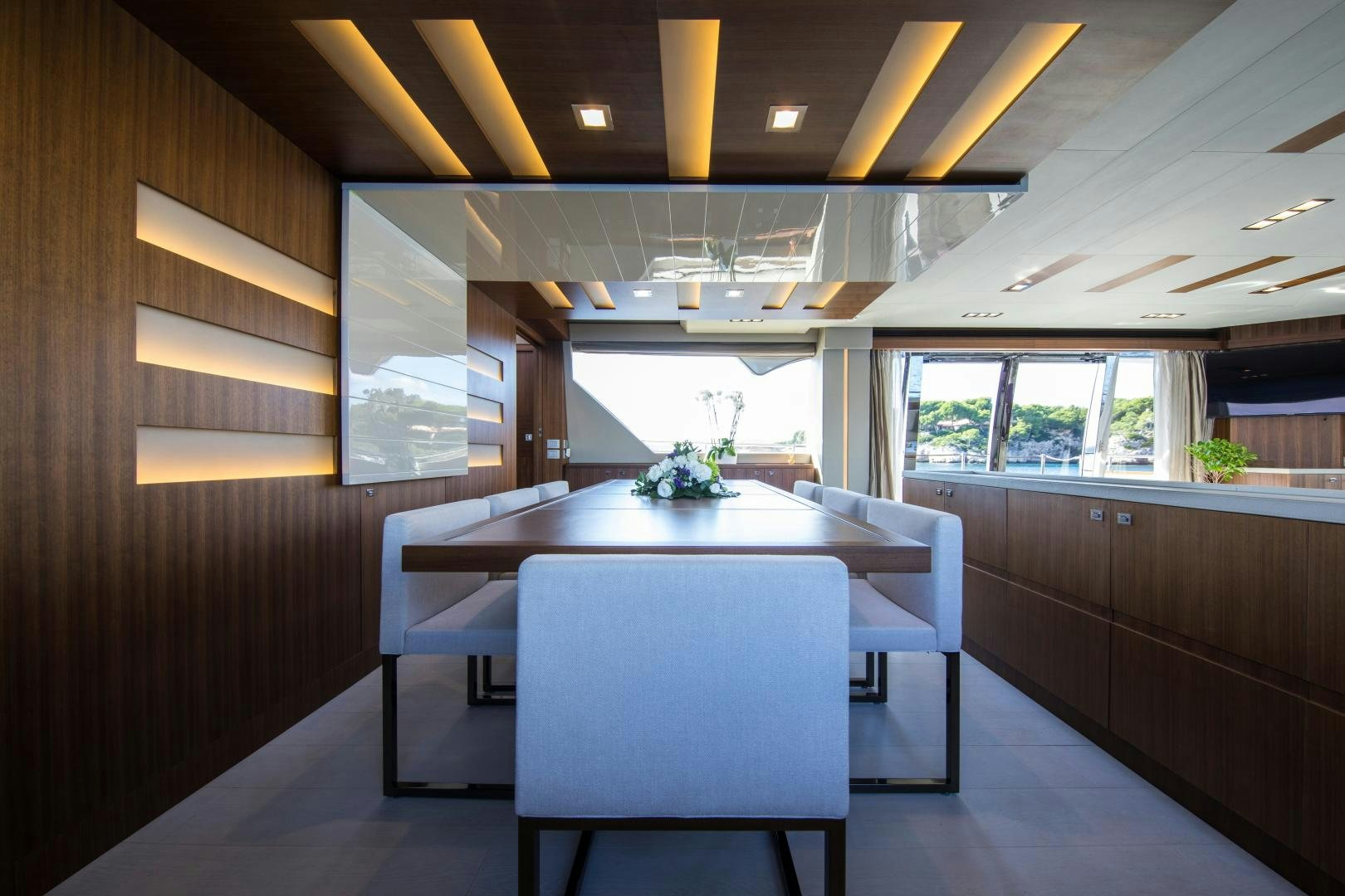 a room with a table and chairs aboard CAMPO VERDE Yacht for Sale