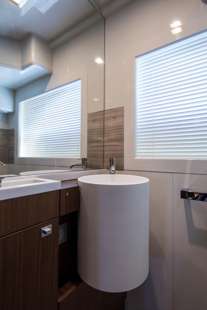 a bathroom with a toilet and a sink aboard CAMPO VERDE Yacht for Sale