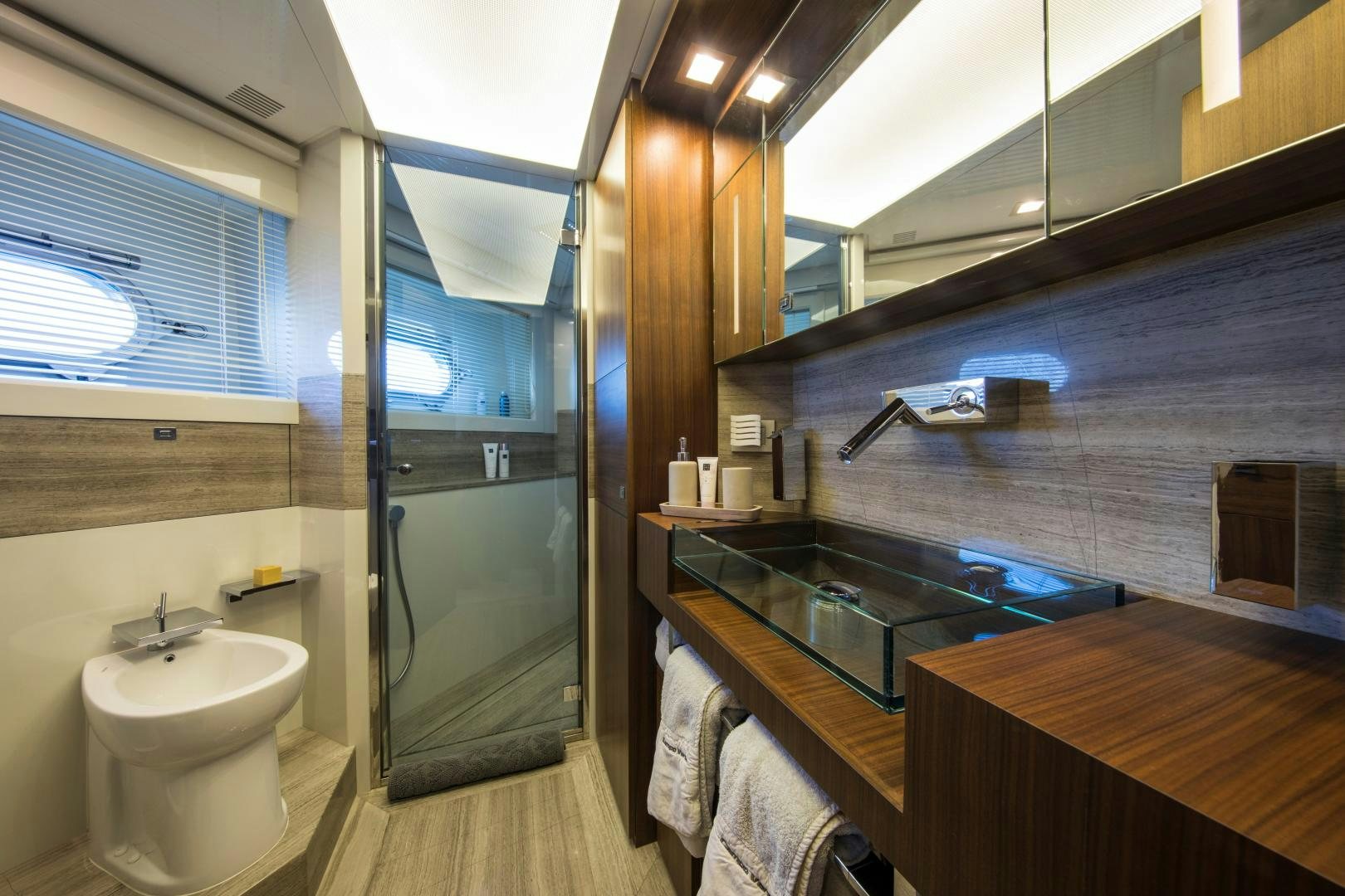 a bathroom with a sink and a shower aboard CAMPO VERDE Yacht for Sale