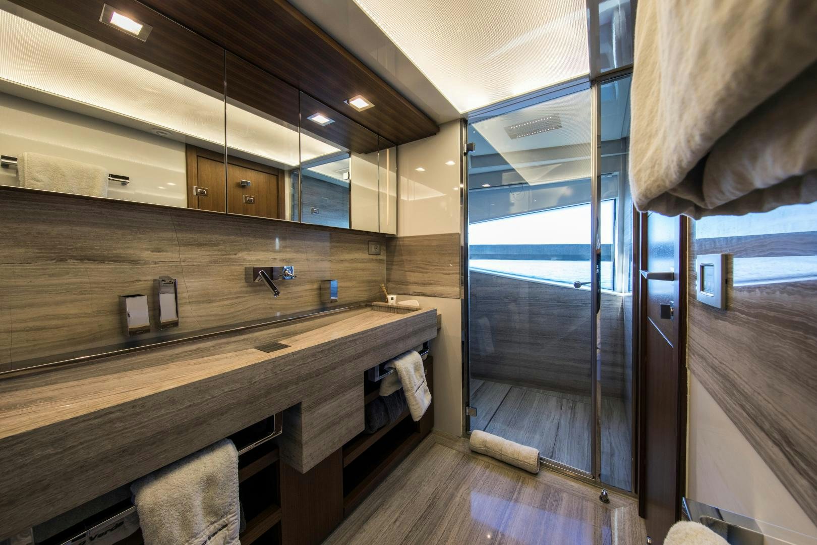 a bathroom with a countertop sink and a shower aboard CAMPO VERDE Yacht for Sale