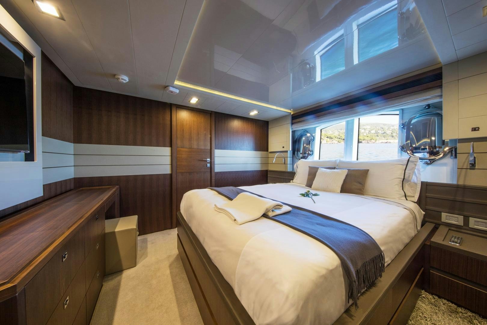 a room with a bed and a desk aboard CAMPO VERDE Yacht for Sale