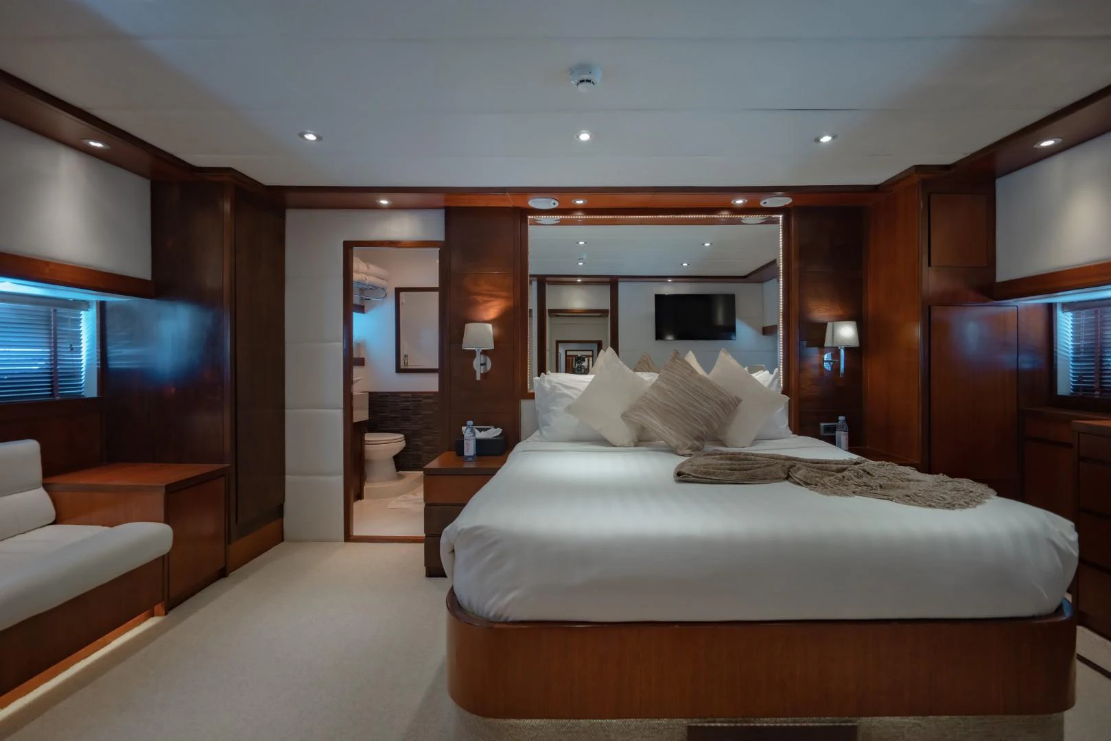 a large bedroom with a large bed aboard MIA KAI Yacht for Sale
