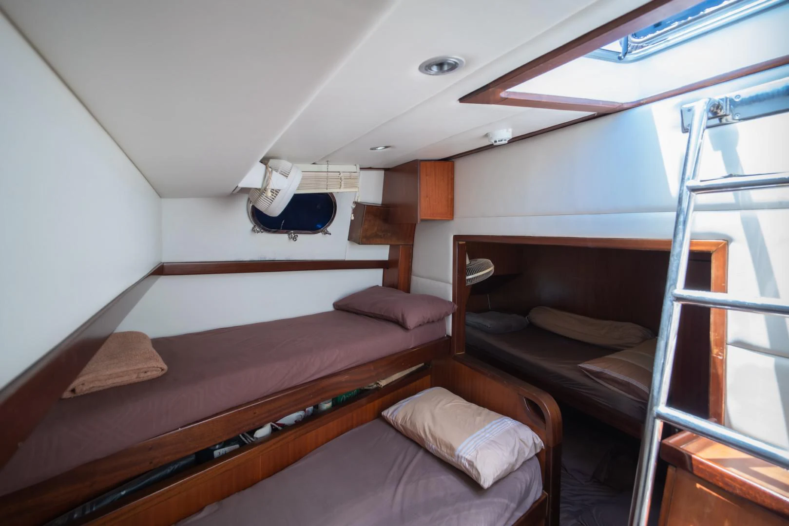 a room with two beds aboard MIA KAI Yacht for Sale