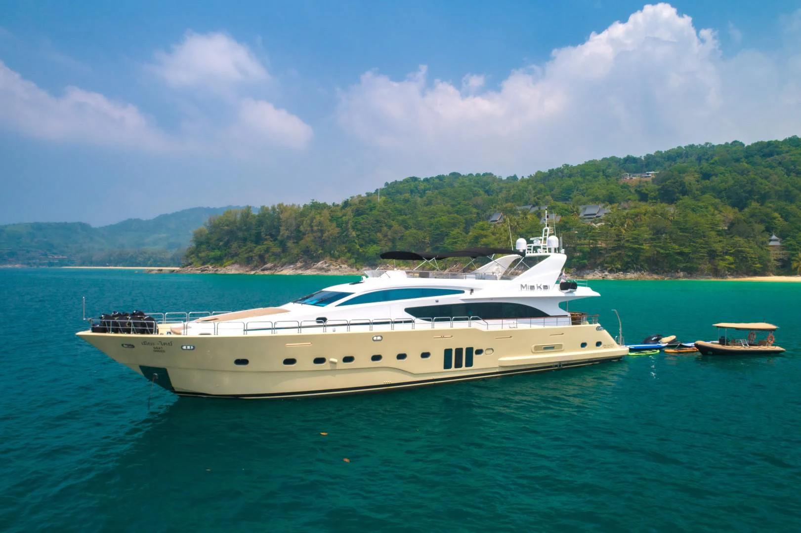 a white yacht in the water aboard MIA KAI Yacht for Sale