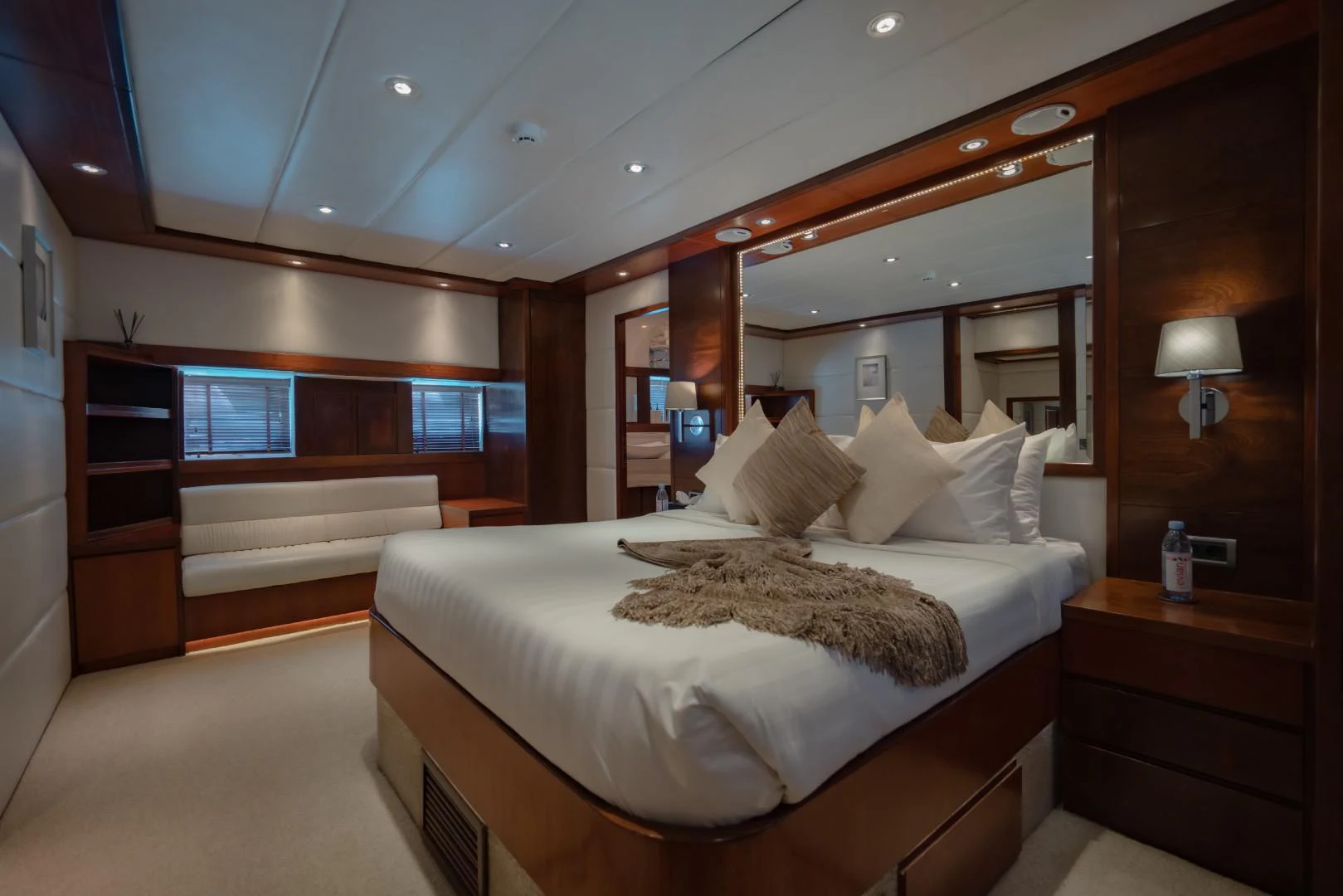 a large bed in a room aboard MIA KAI Yacht for Sale