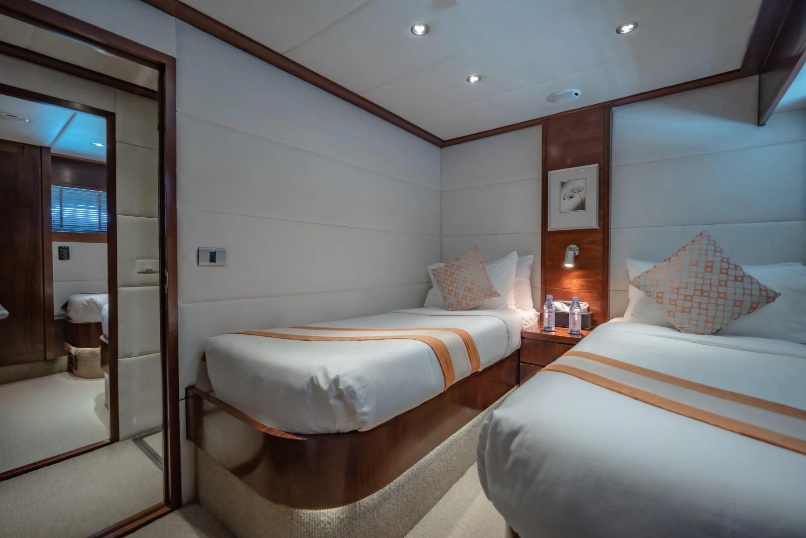 a room with two beds aboard MIA KAI Yacht for Sale
