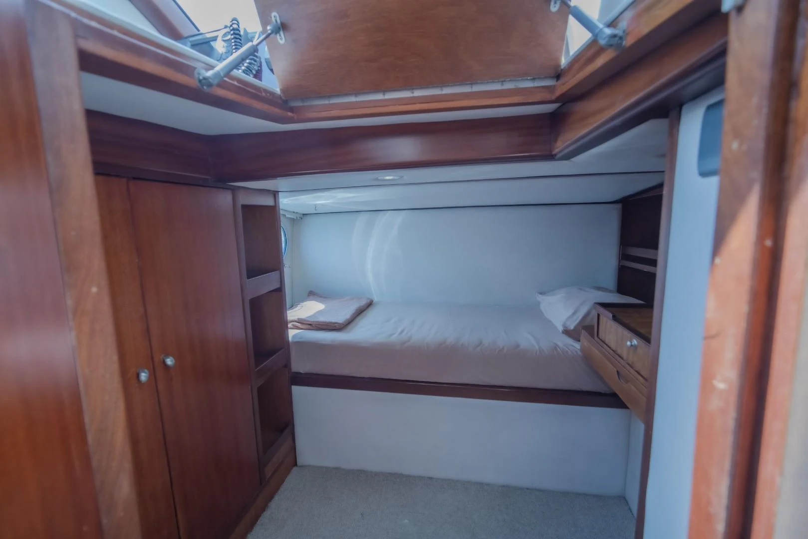 a bed in a room aboard MIA KAI Yacht for Sale