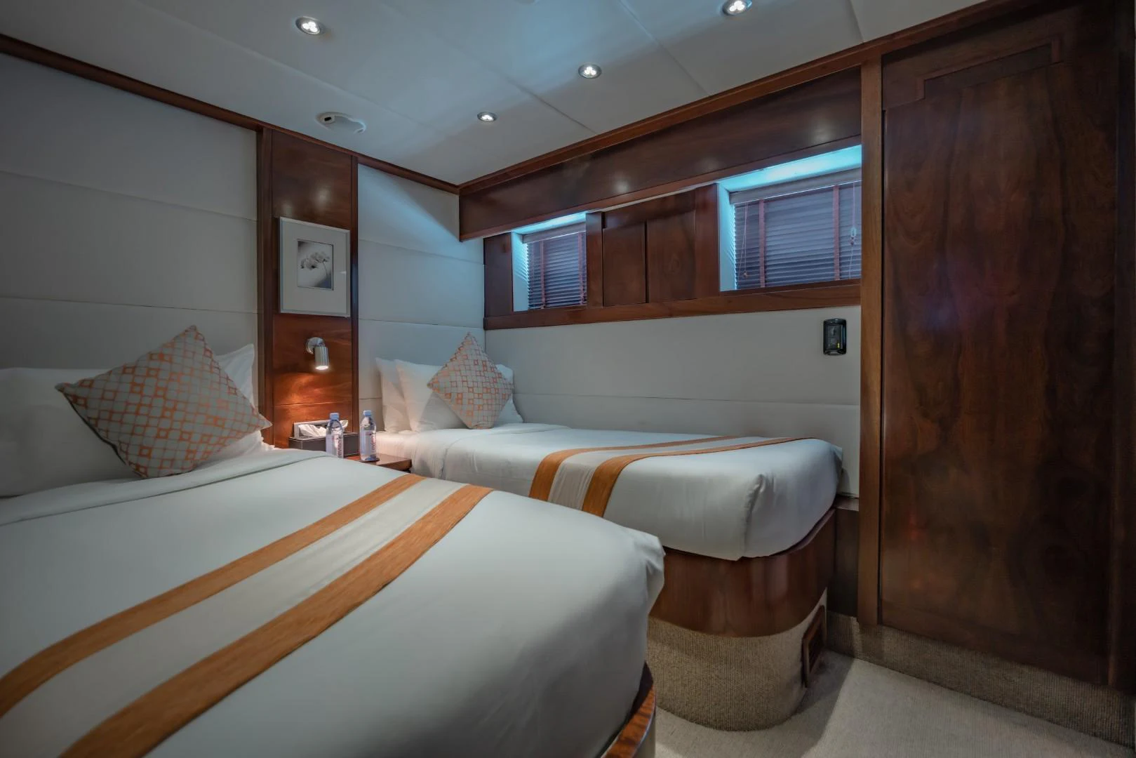 a room with two beds aboard MIA KAI Yacht for Sale