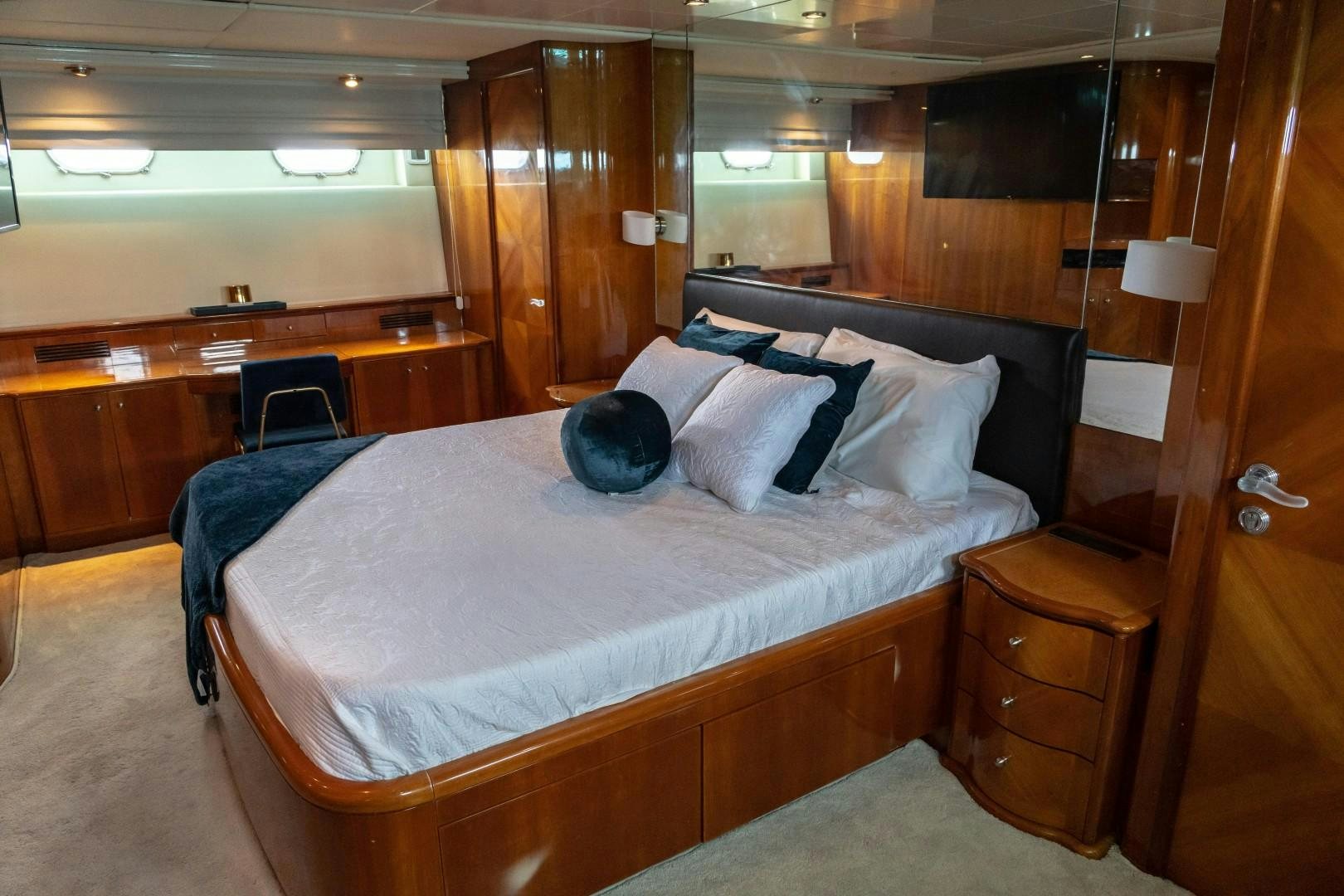 a bed with white sheets and pillows aboard EL CAPRICHO Yacht for Sale