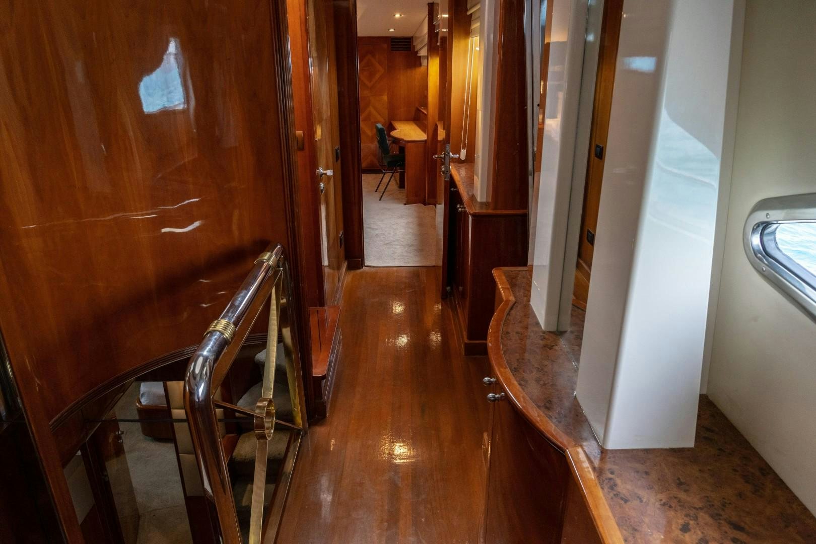 a hallway with chairs and a table aboard EL CAPRICHO Yacht for Sale