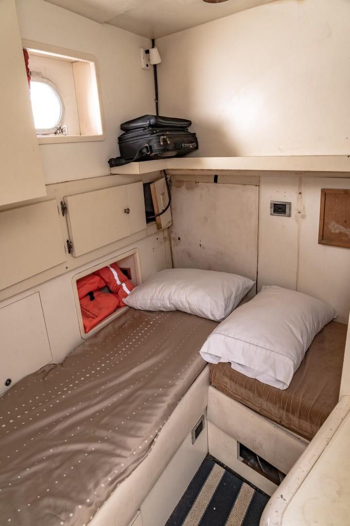 a small room with two beds aboard EL CAPRICHO Yacht for Sale