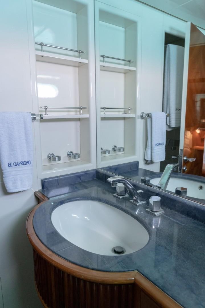 a bathroom with a sink and a mirror aboard EL CAPRICHO Yacht for Sale