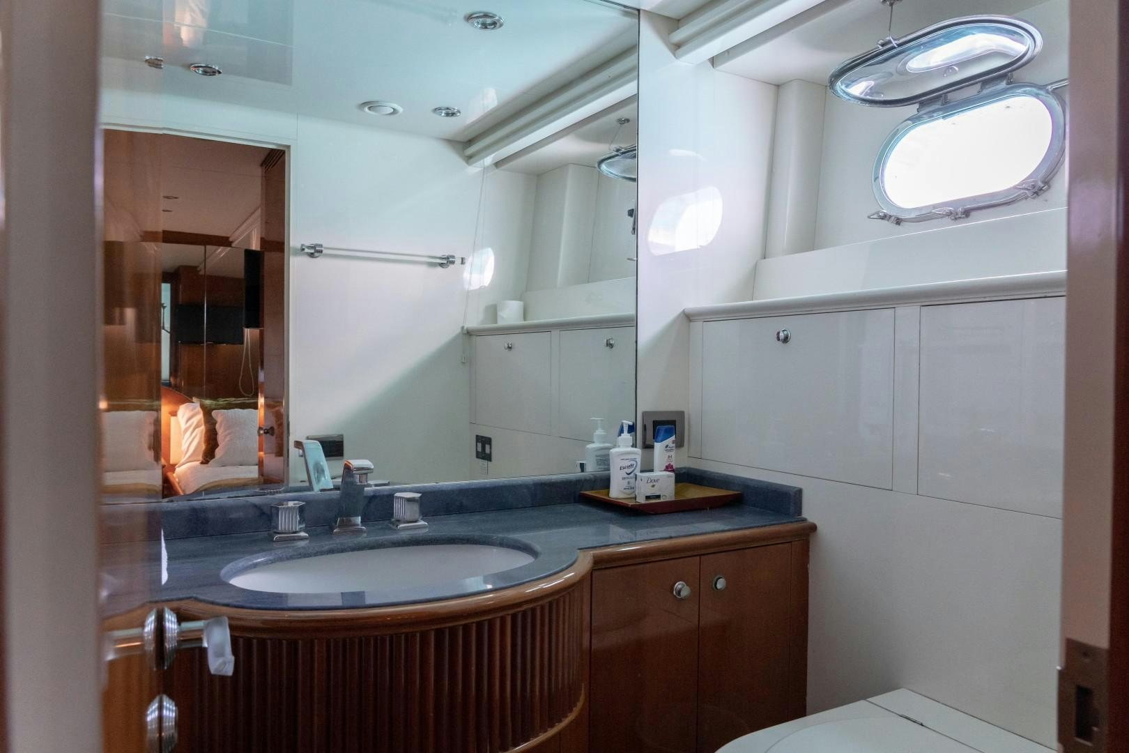 a bathroom with a sink and a mirror aboard EL CAPRICHO Yacht for Sale
