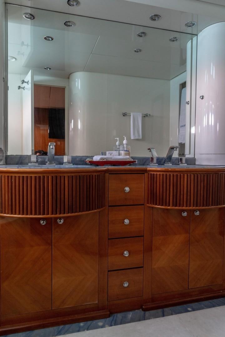a bathroom with a large mirror aboard EL CAPRICHO Yacht for Sale