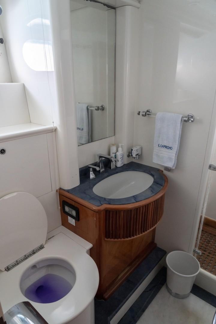 a bathroom with a sink and toilet aboard EL CAPRICHO Yacht for Sale