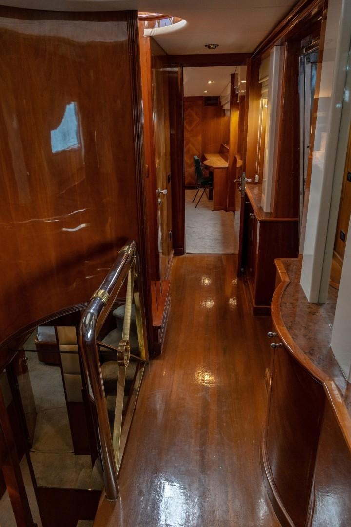 a hallway with wood cabinets aboard EL CAPRICHO Yacht for Sale