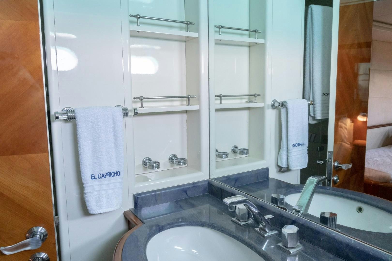 a bathroom with a large mirror aboard EL CAPRICHO Yacht for Sale