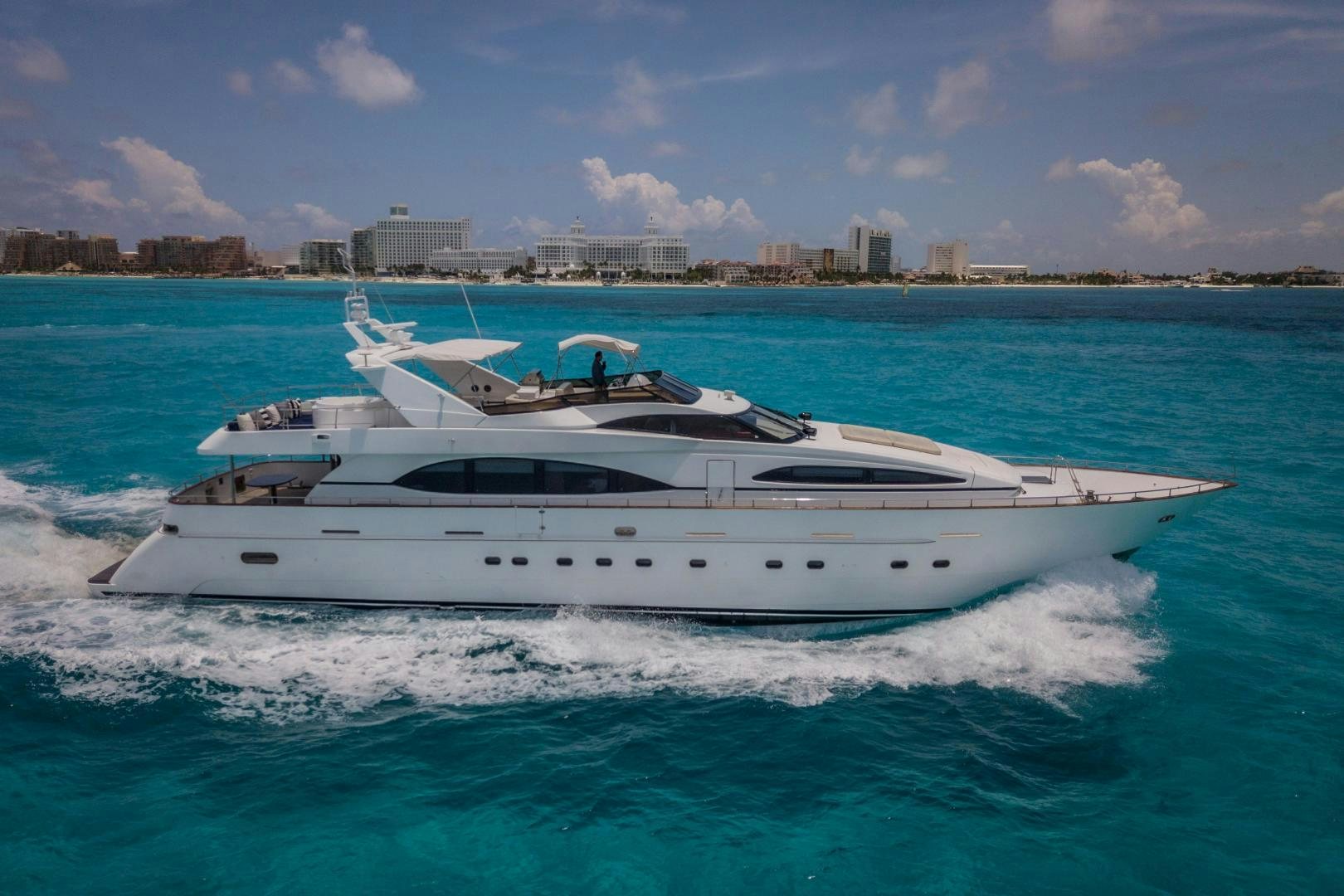 a white yacht on the water aboard EL CAPRICHO Yacht for Sale
