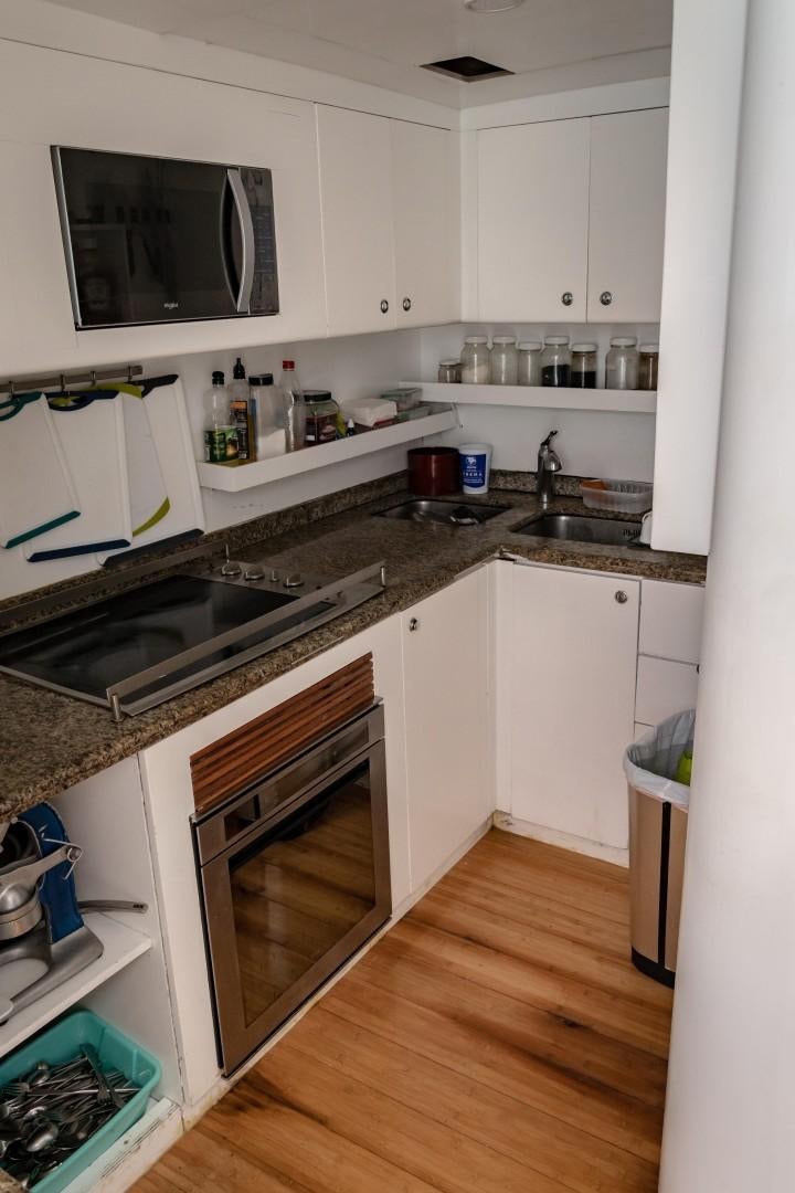 a kitchen with a microwave oven aboard EL CAPRICHO Yacht for Sale