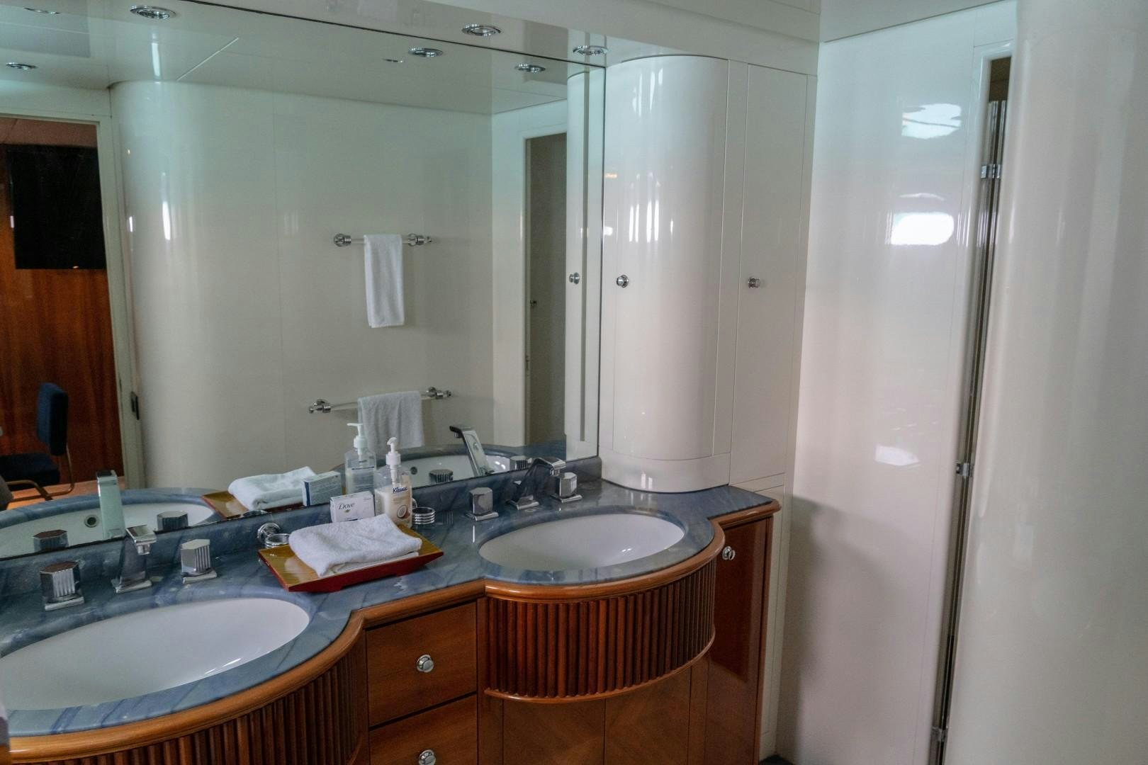 a bathroom with a sink and a mirror aboard EL CAPRICHO Yacht for Sale