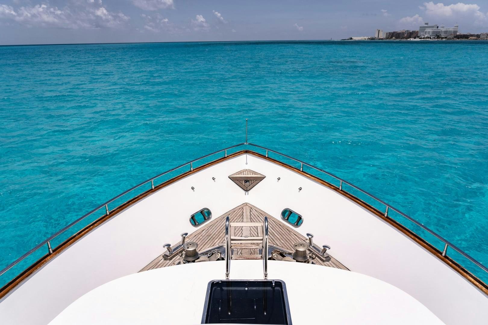 a large boat on the water aboard EL CAPRICHO Yacht for Sale