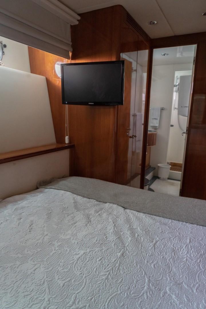 a bed with a television on it aboard EL CAPRICHO Yacht for Sale