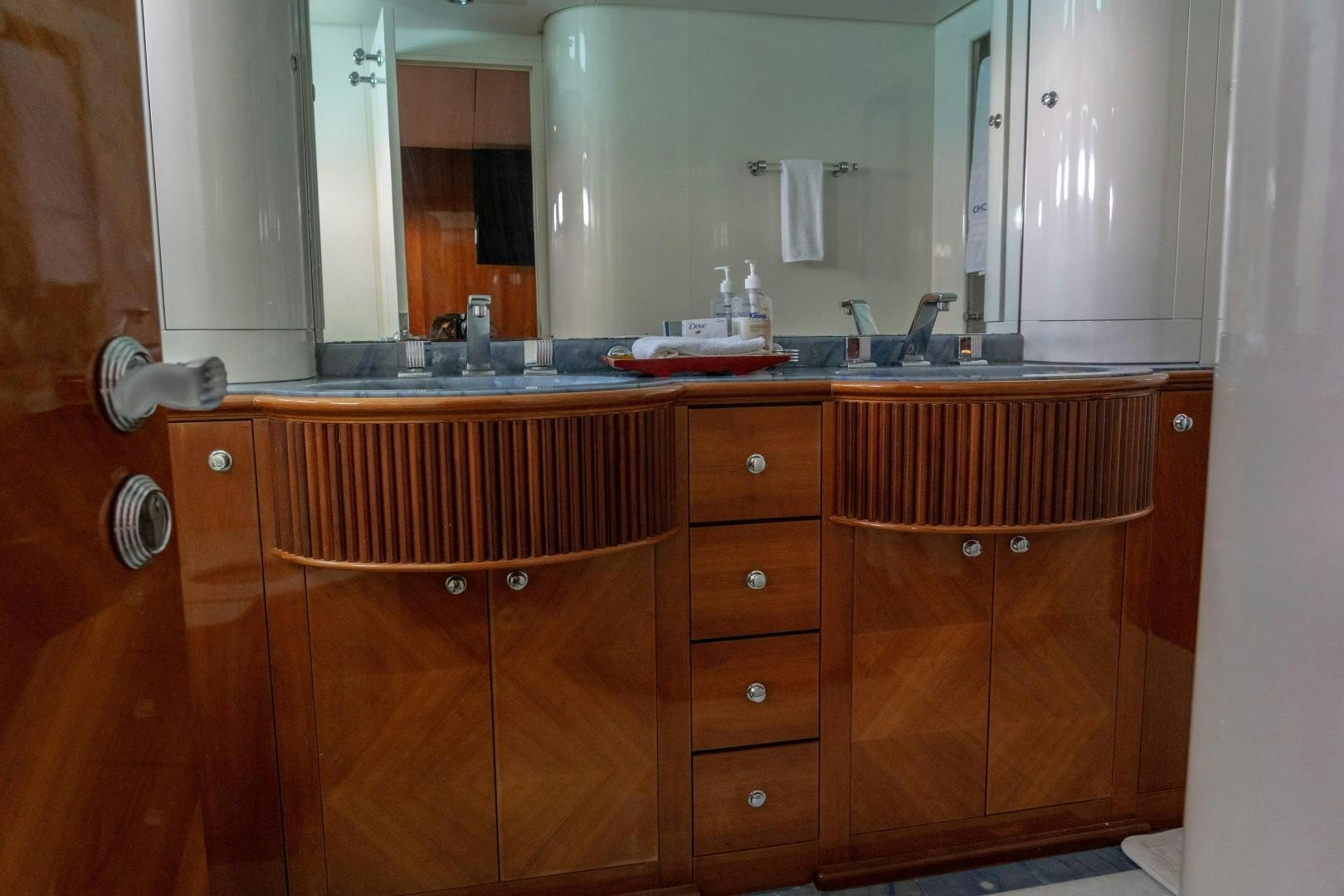 a bathroom with a sink and cabinets aboard EL CAPRICHO Yacht for Sale
