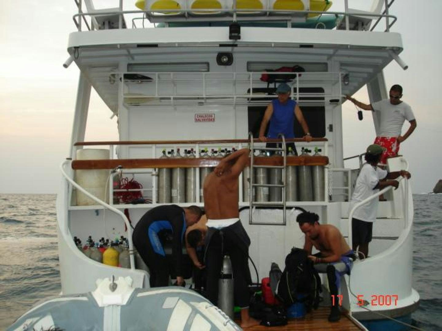 a group of men on a boat aboard No Name Yacht for Sale