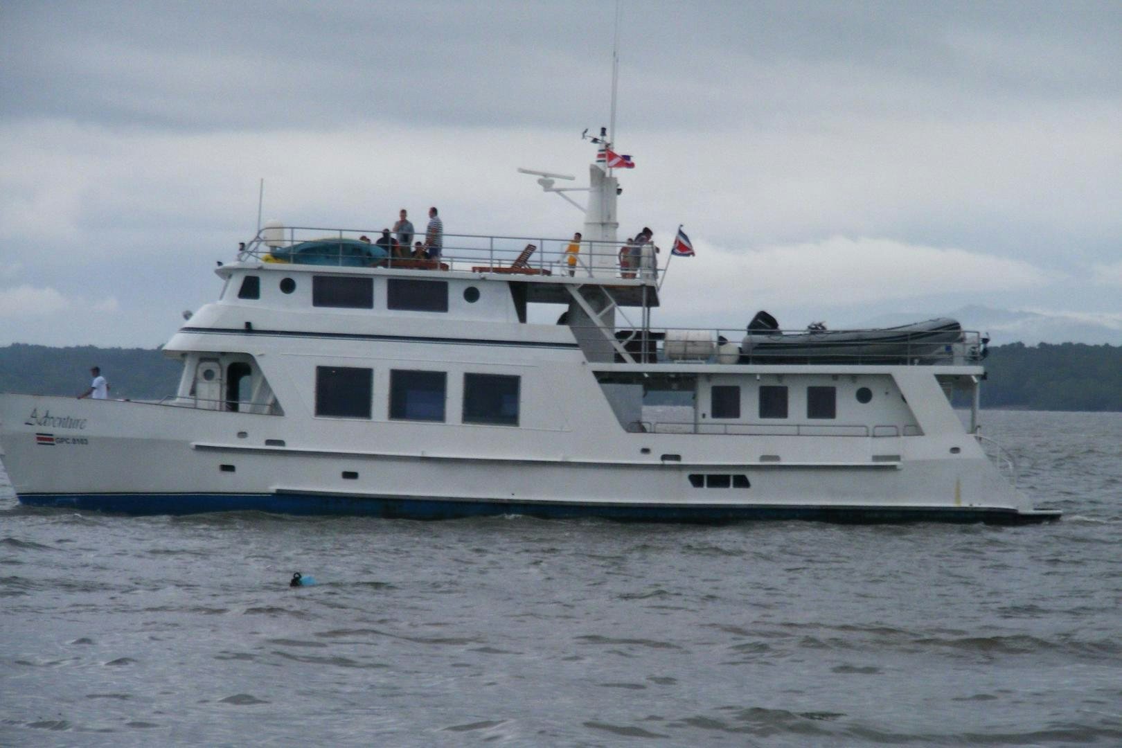 a large white boat with people on it aboard No Name Yacht for Sale