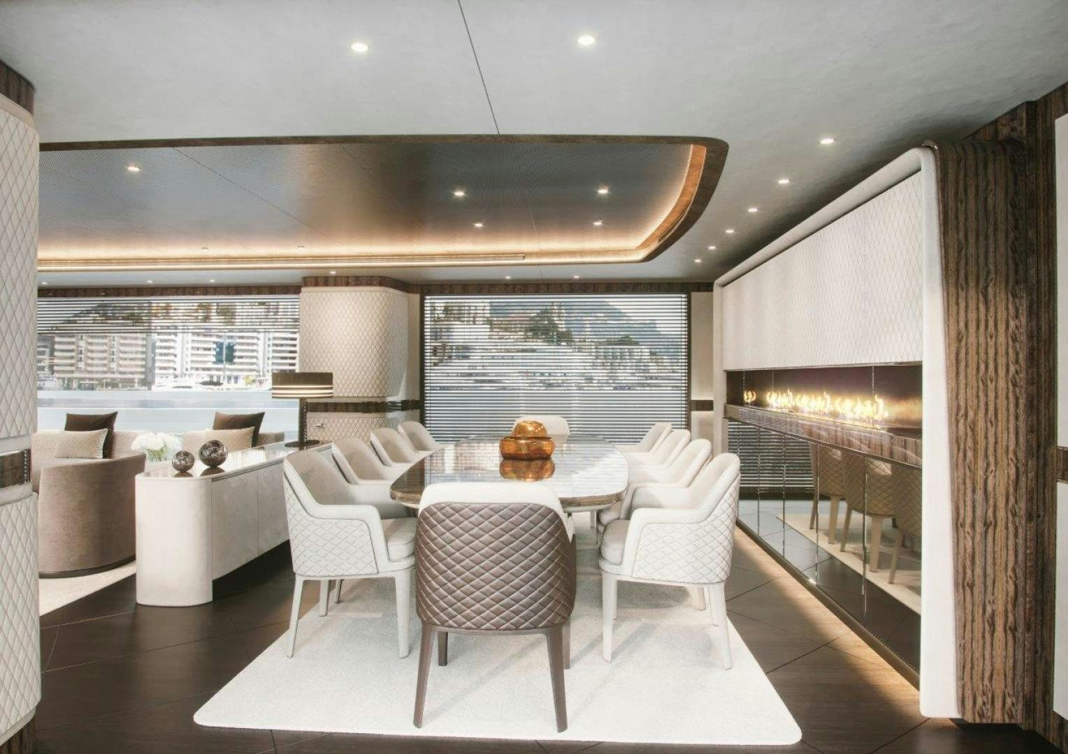 a room with a table chairs and a window aboard G 300 Yacht for Sale