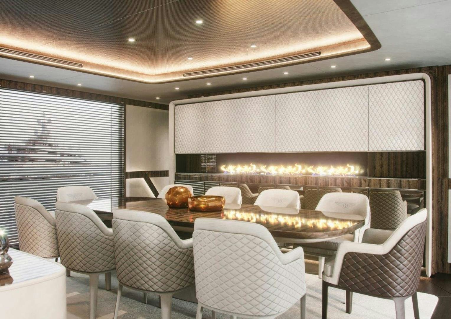 a large room with chairs and a table with a large screen aboard G 300 Yacht for Sale