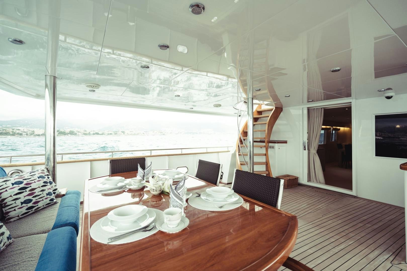 a dining table in a room aboard WIZARD Yacht for Sale
