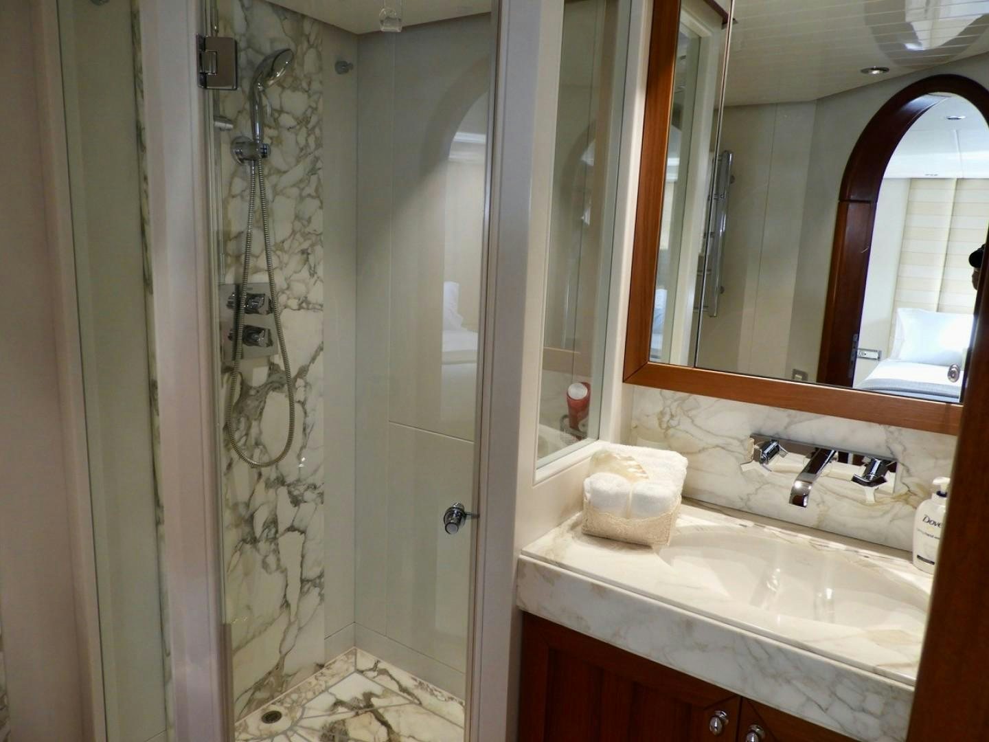 a bathroom with a sink and a mirror aboard WIZARD Yacht for Sale