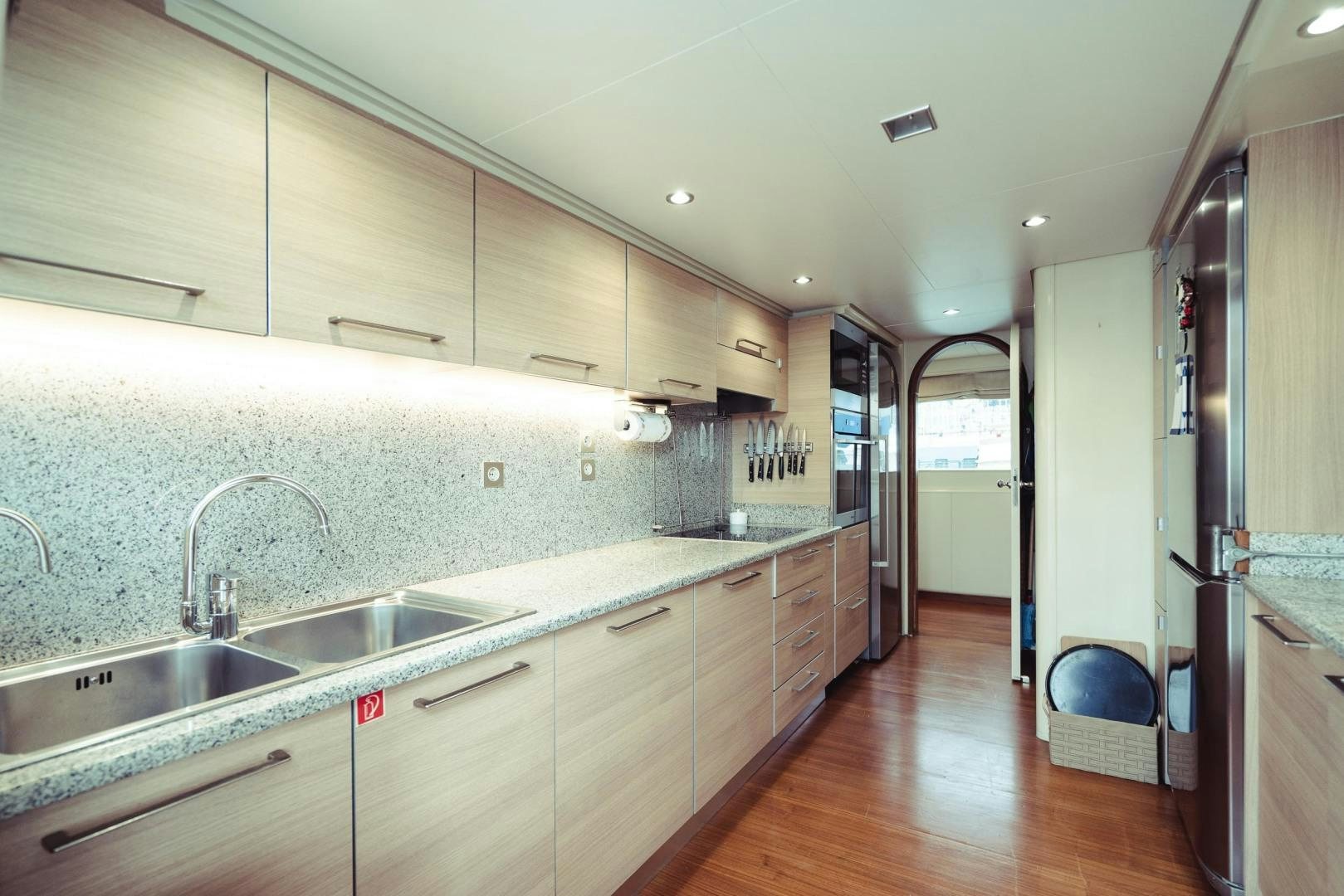 a kitchen with a large island aboard WIZARD Yacht for Sale
