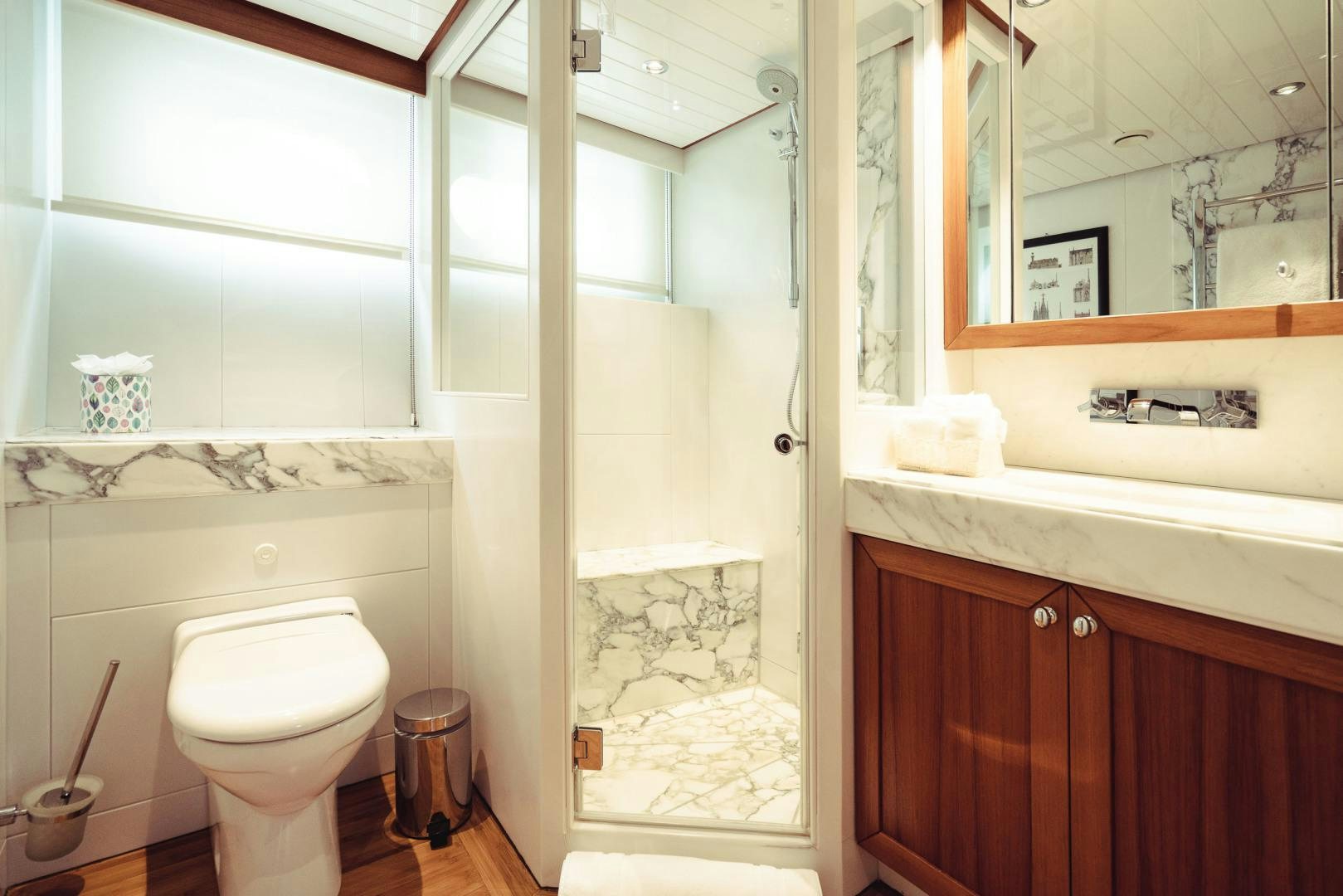 a bathroom with a glass shower aboard WIZARD Yacht for Sale