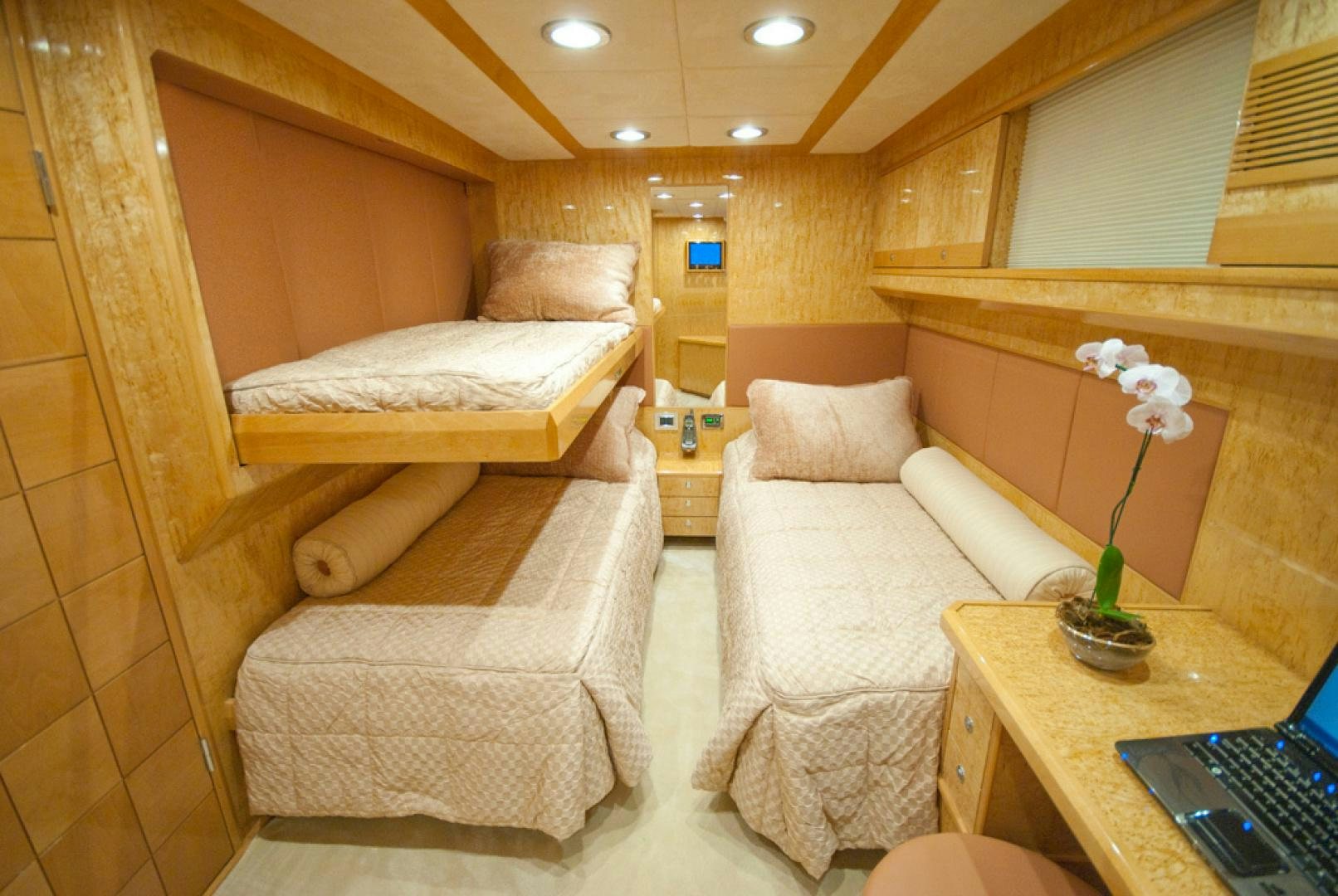 a room with a bed and a desk aboard RED PEARL Yacht for Sale